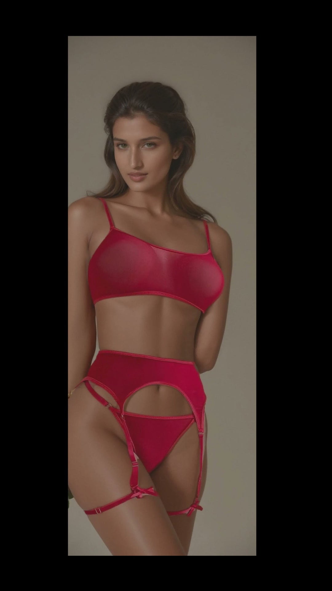 Woman wearing a red lingerie set on a plain background